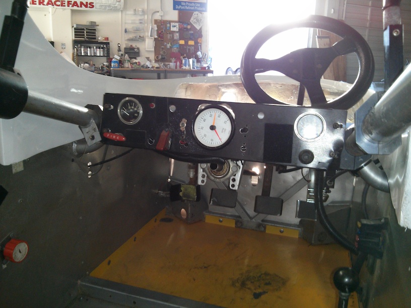 Cockpit view with seat, wheel, and bodywork removed.